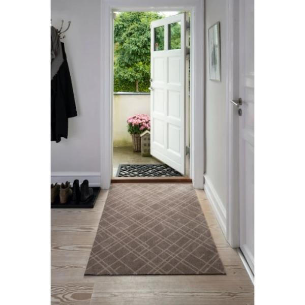 Lines teppe sand og beige fra Tica Copenhagen